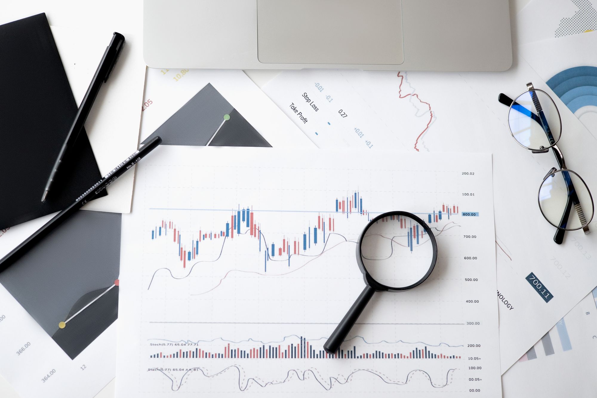 Analyst reviewing forecast charts and probability bands